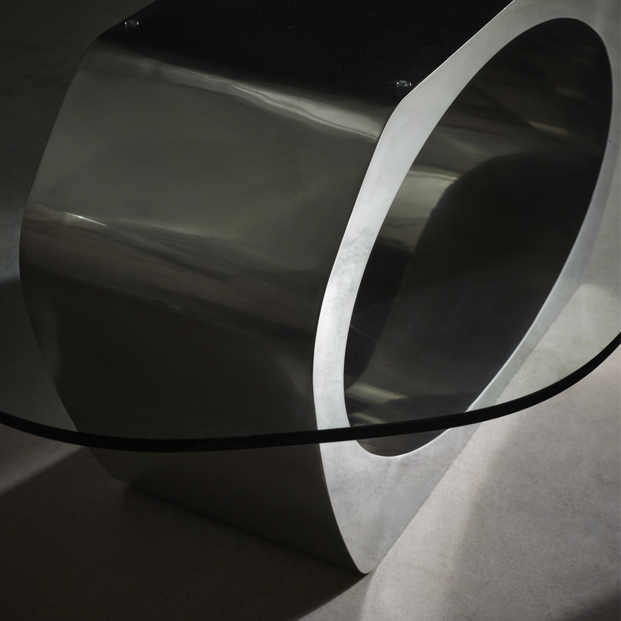 Skye dining table with polished steel finish detail