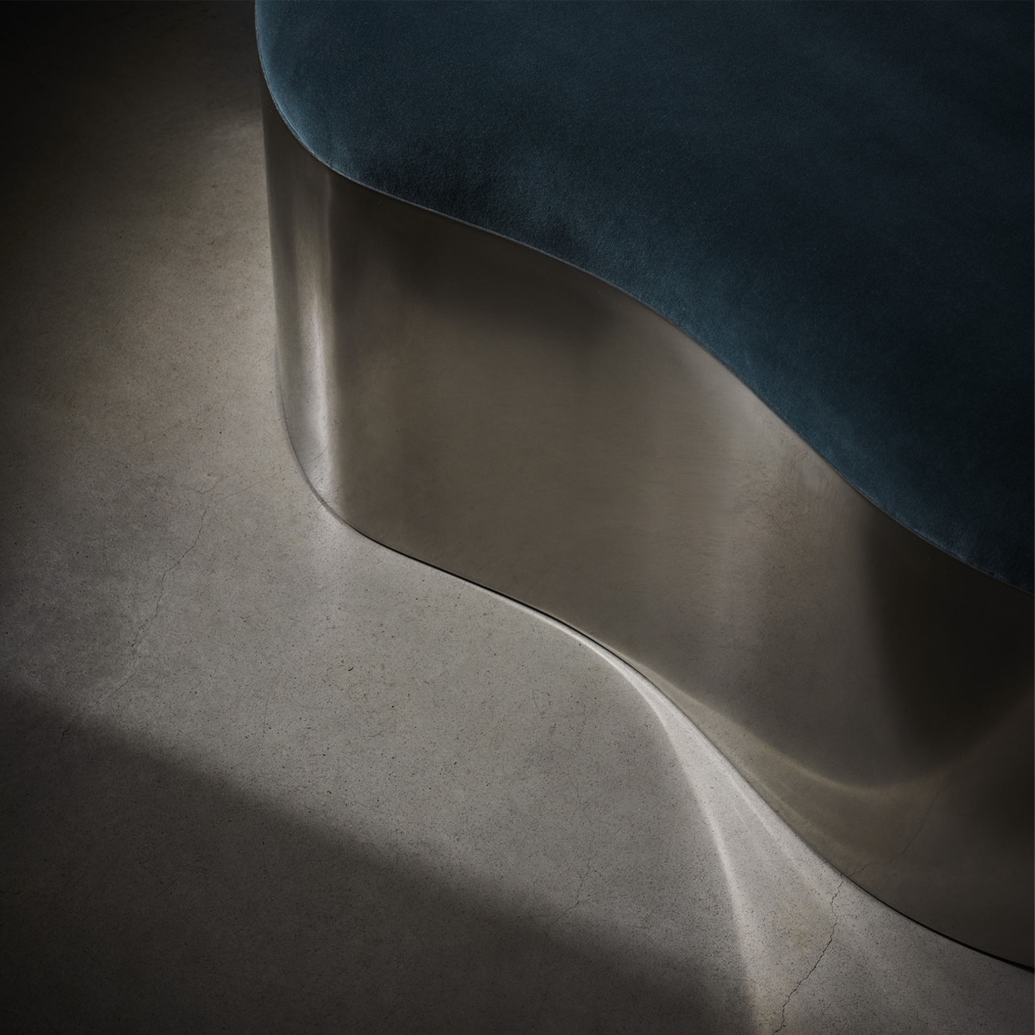 Lily ottoman in polished stainless steel and COM detail