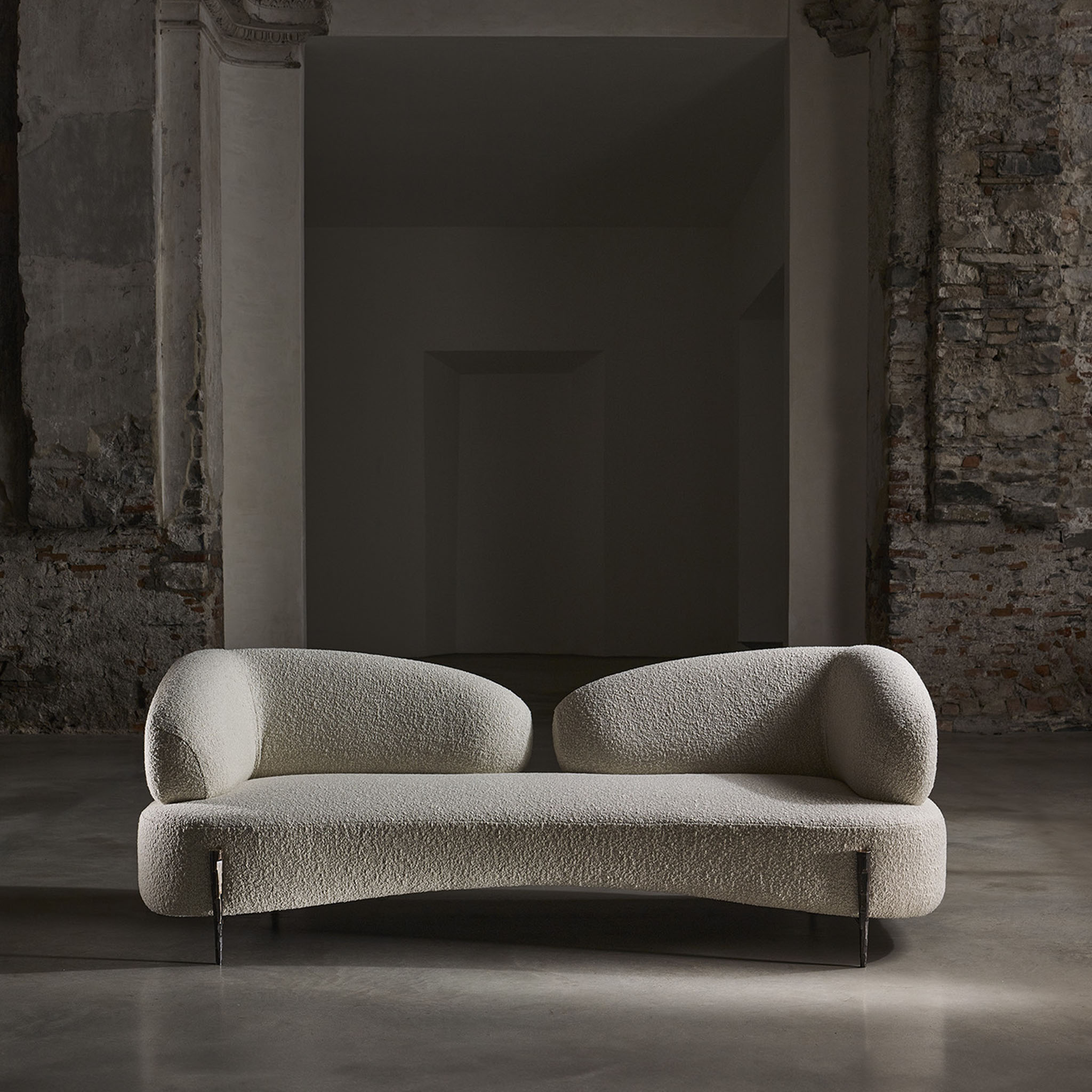 Cloud sofa with hammered bronze legs