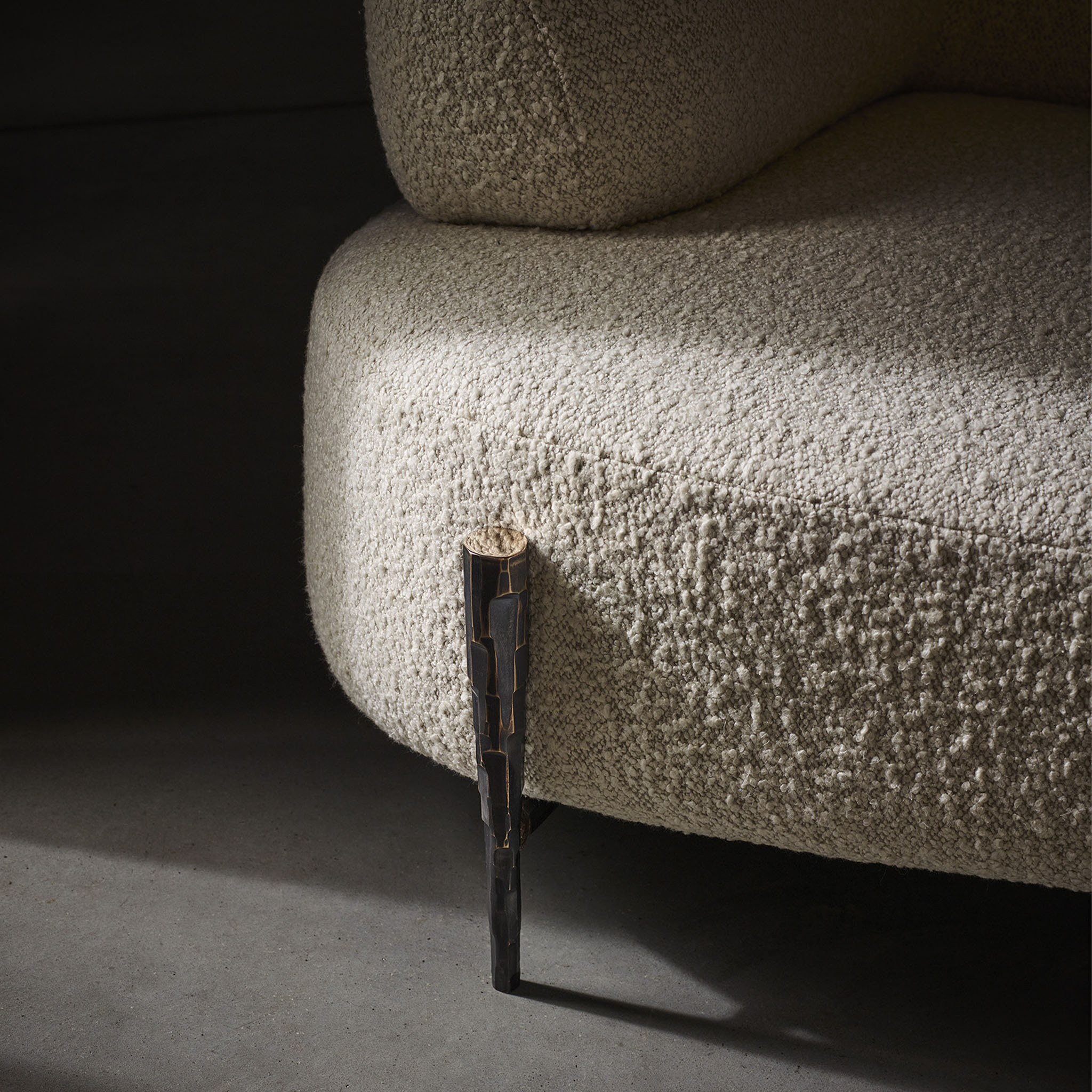 Cloud sofa with hammered bronze legs detail