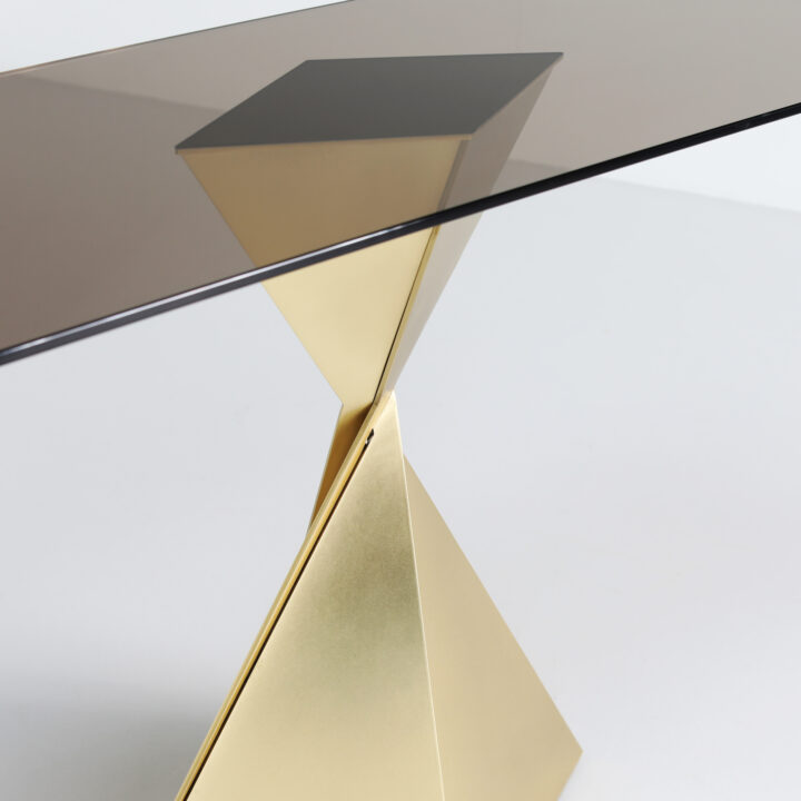 Made with Brass paired with a smoked glass top