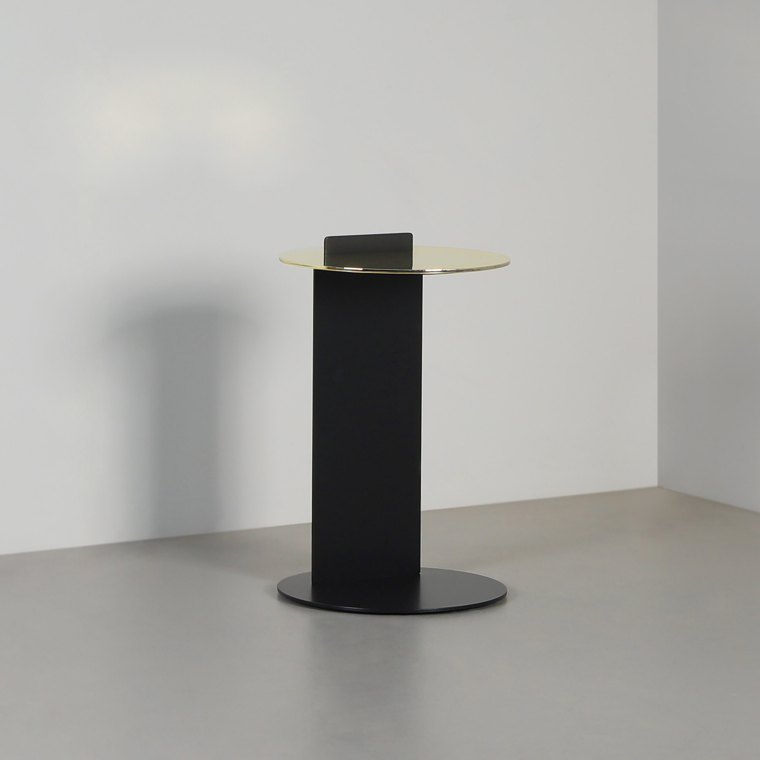 Finished in "Anthracite" with a Polished Brass top