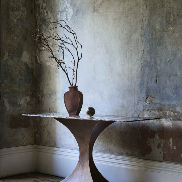 Finished in "Rose Pewter" with a Rosso Luana marble top