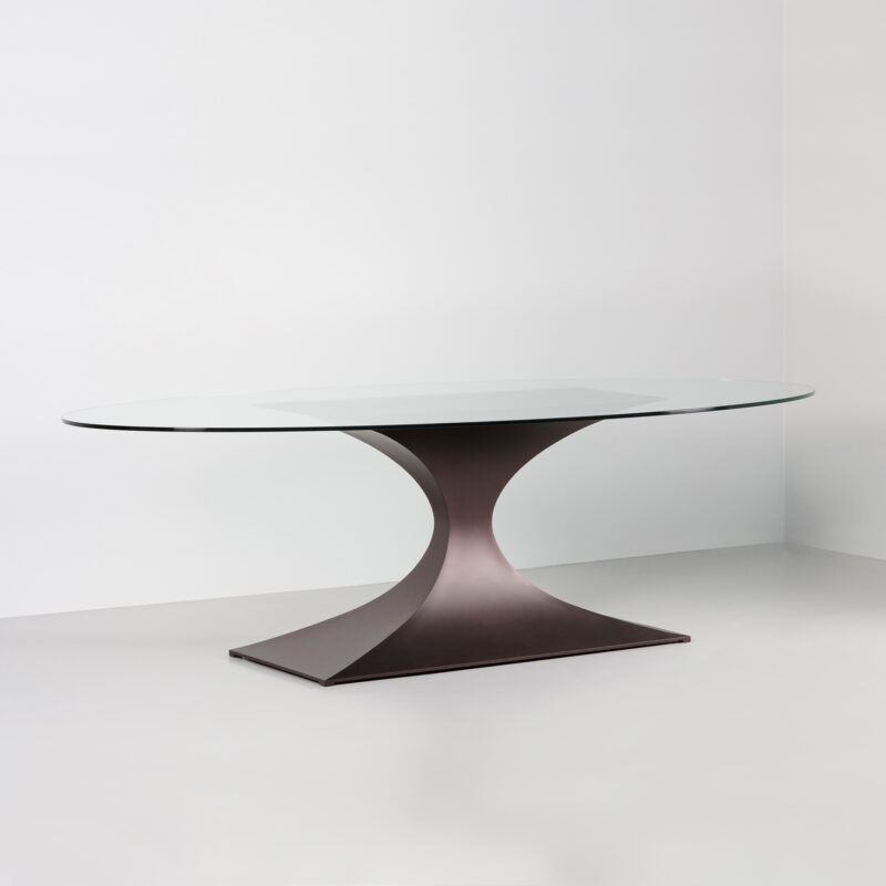 sculptural dining table with glass top