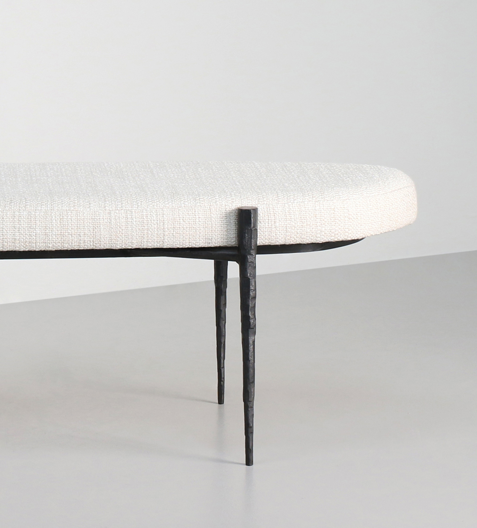 Hammered Steel legs upholstered in a cream boucle