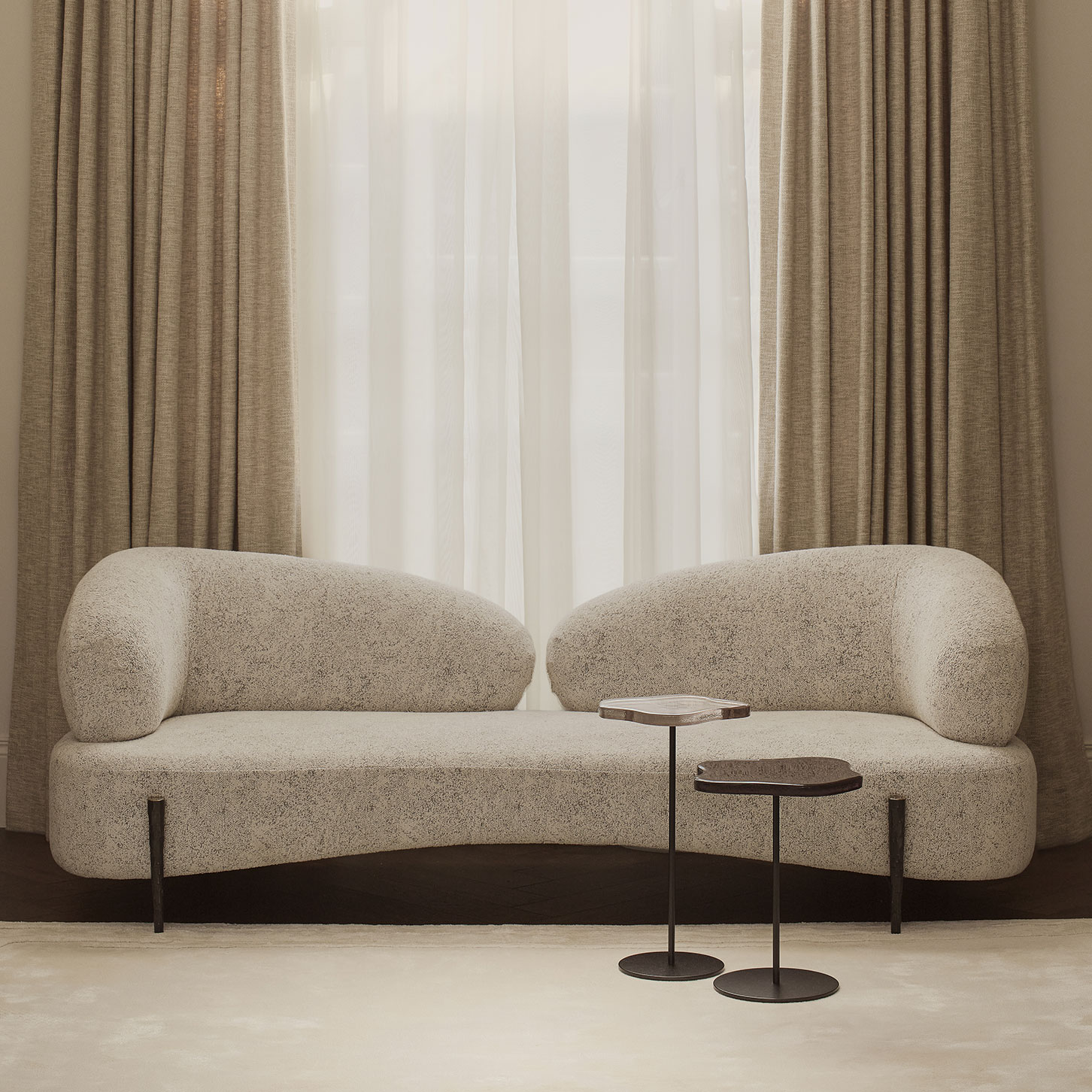 Cloud sofa with hammered bronze legs and two Lily cocktail tables