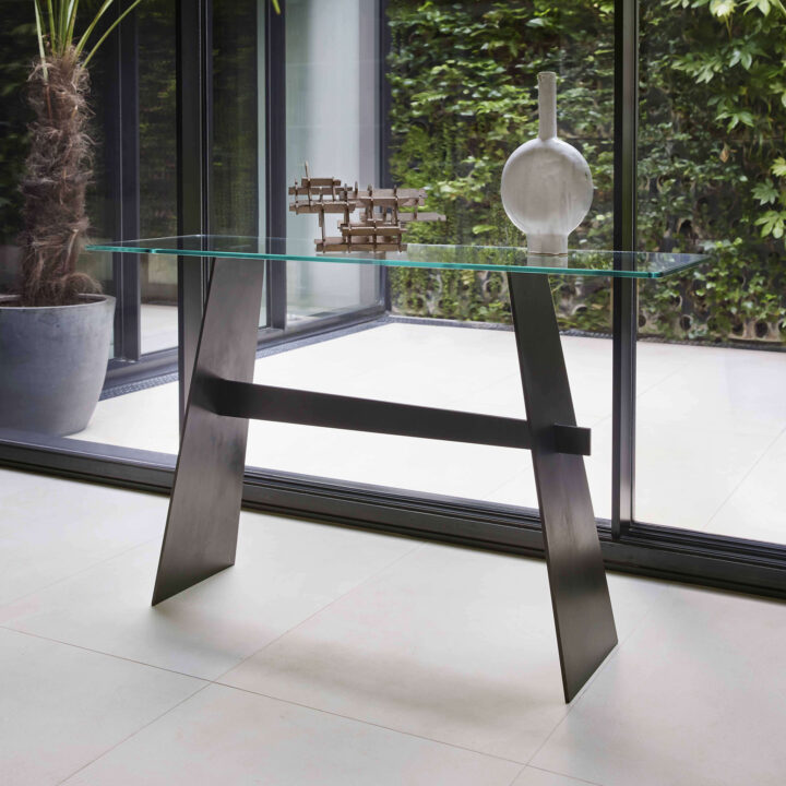 Finished with "Black Patina" with a clear glass top