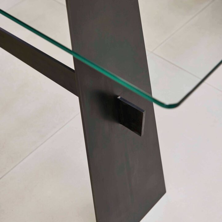 Finished with "Black Patina" with a clear glass top