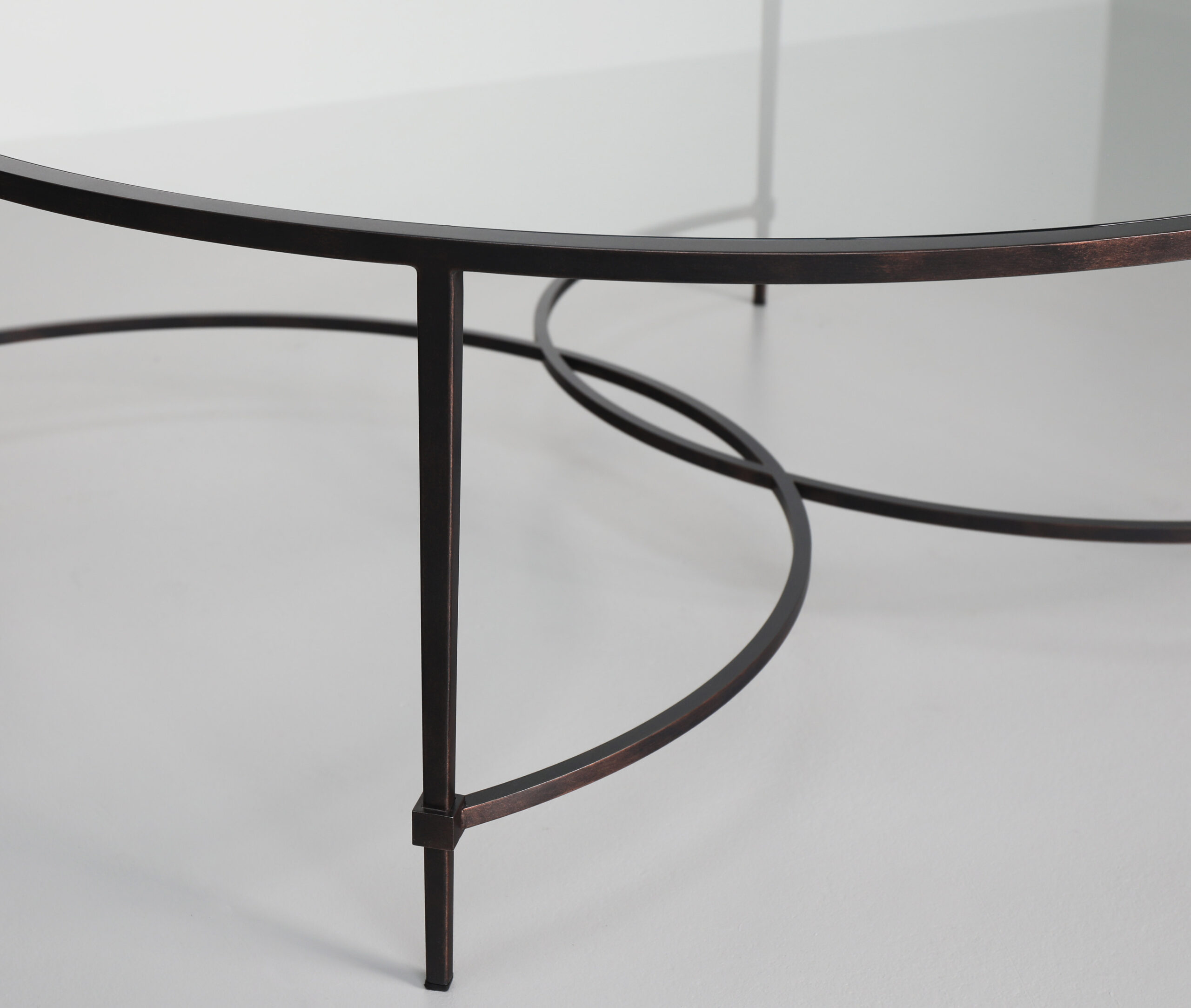 Finished in "Antique Bronze" with a clear glass top
