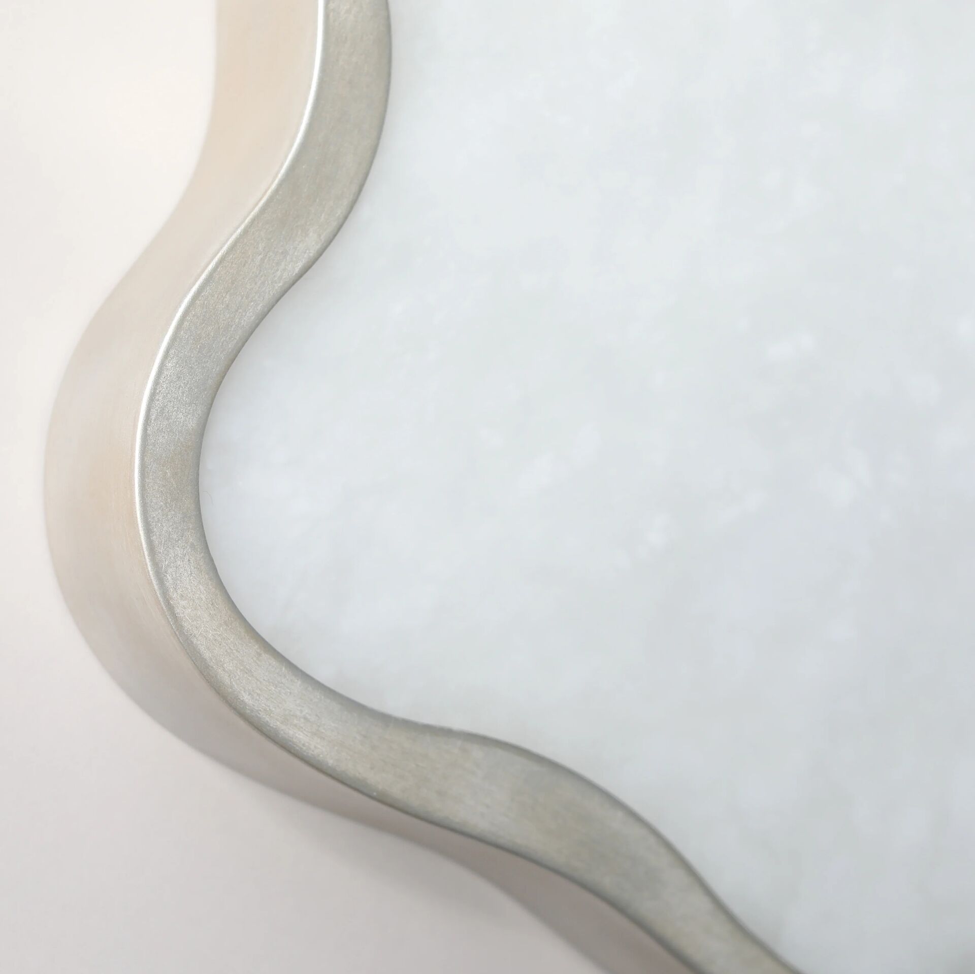 Lily Wall Light finished in “Persian Silver” and alabaster pane