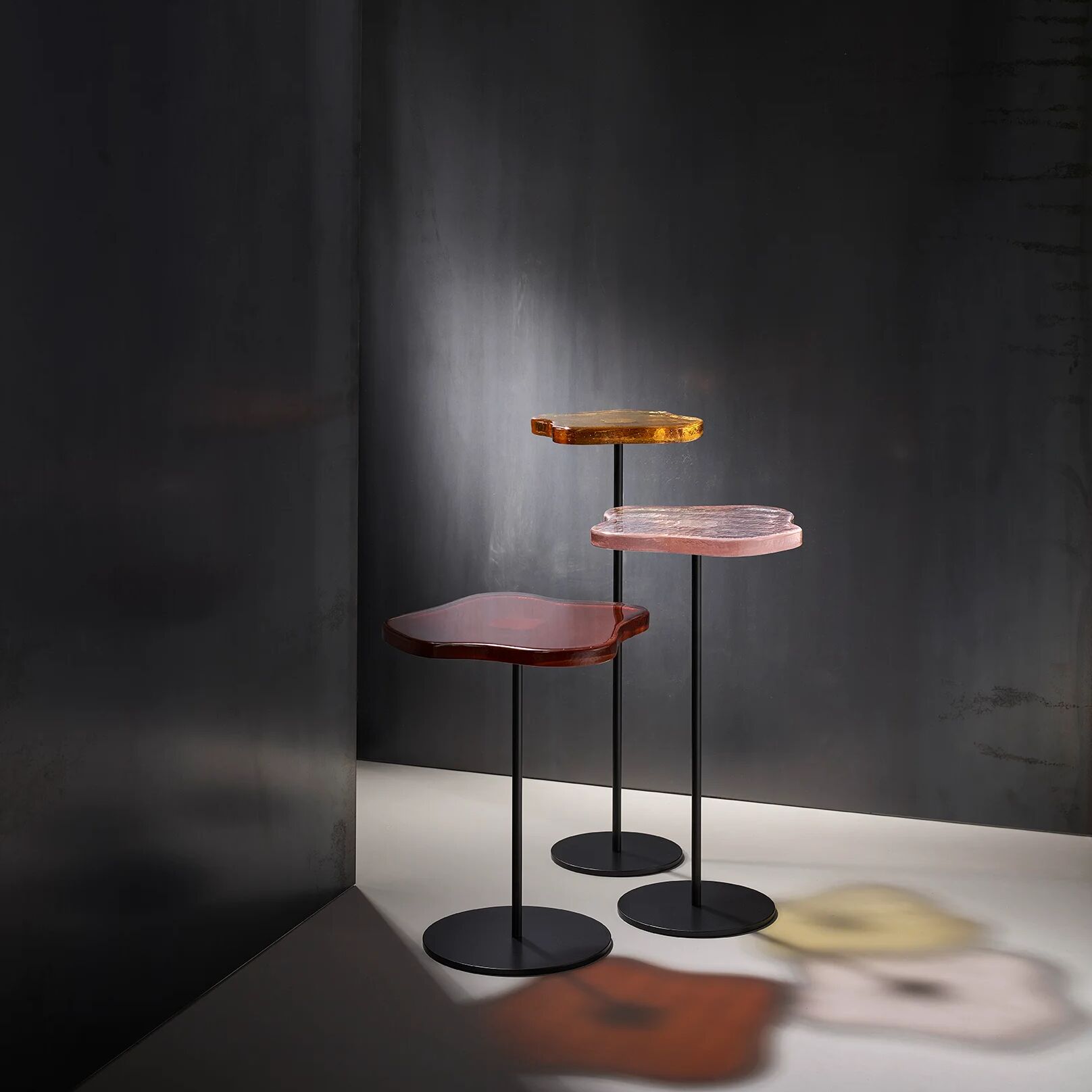 Lily cocktail tables, finished in "Anthracite" with Amber, Peach & Lemon tops