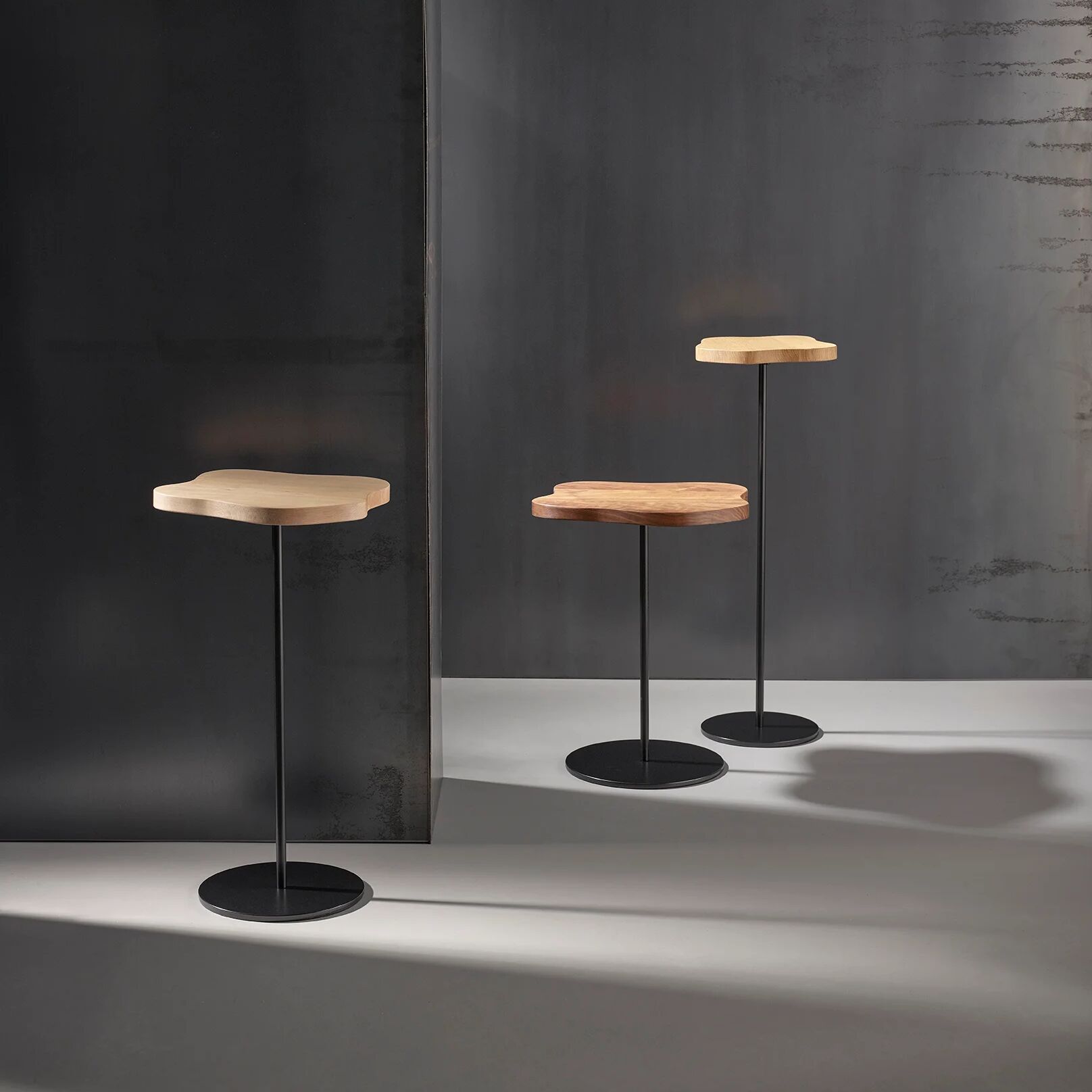 Lily cocktail tables, finished in "Anthracite" with Beech, Oak & Maple tops