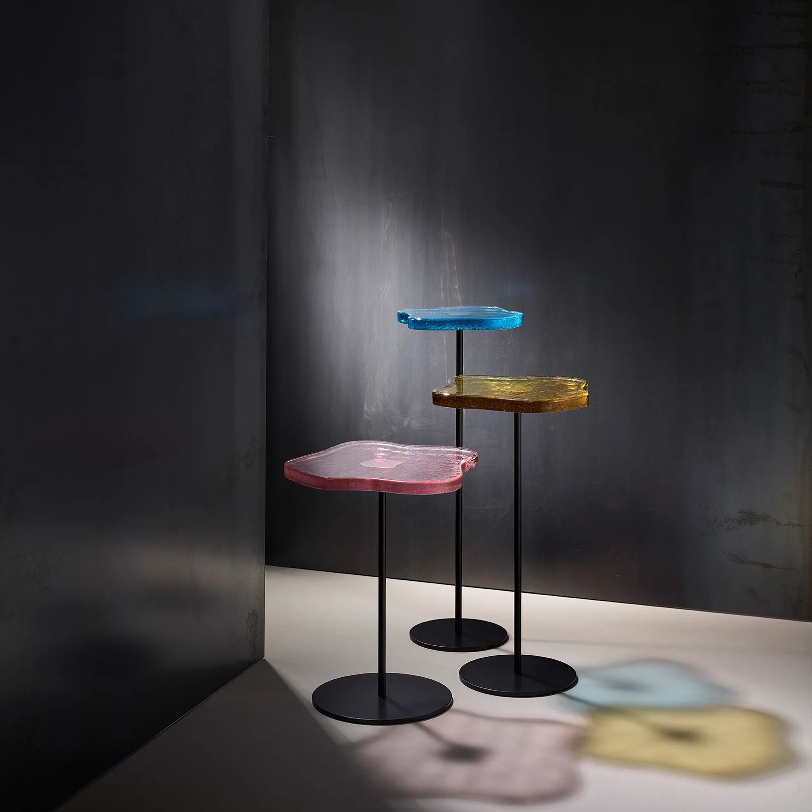 Lily cocktail tables, finished in "Anthracite" with Azure, Rose & Lemon tops
