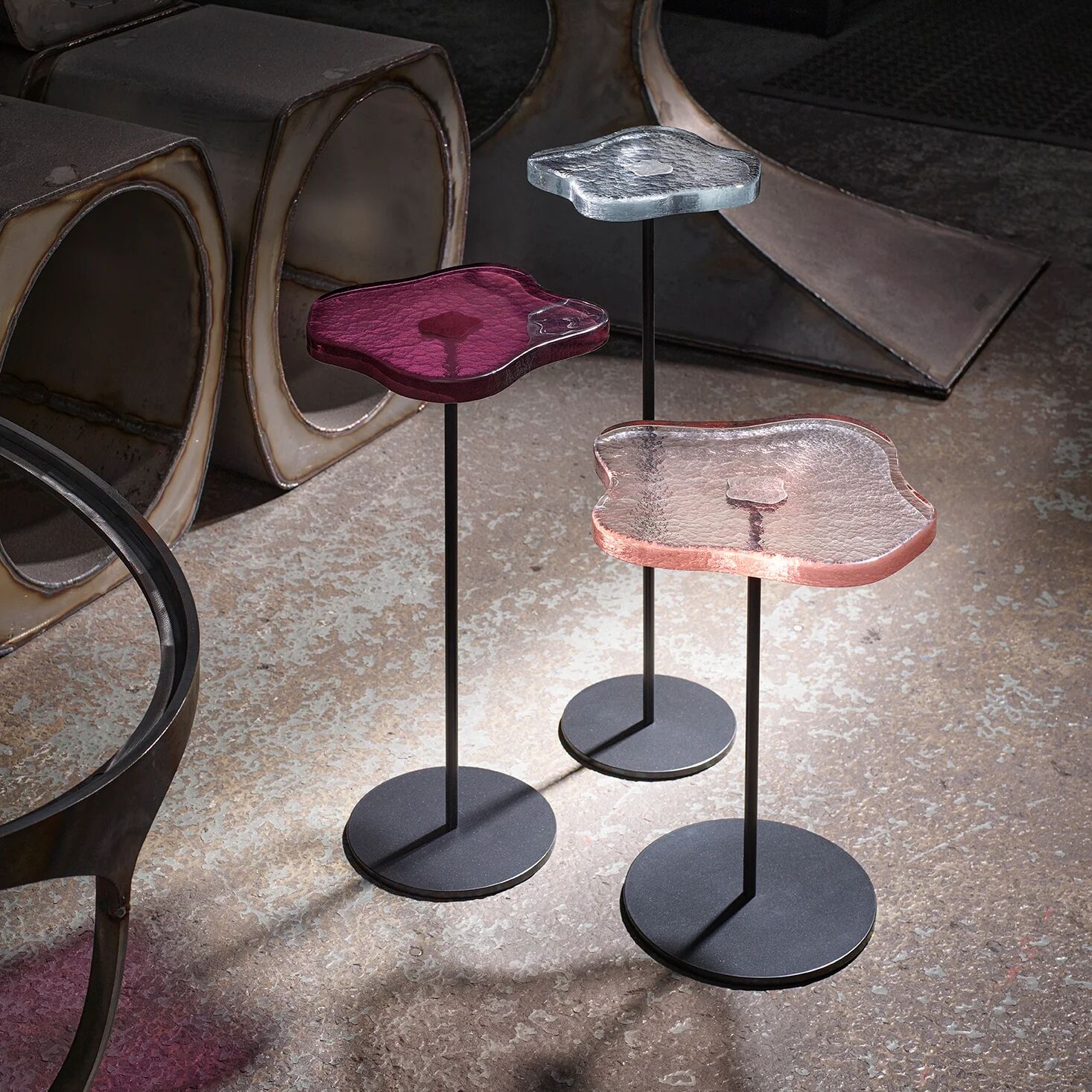 Lily cocktail tables, finished in "Anthracite" with Clear, Peach & Amethyst tops