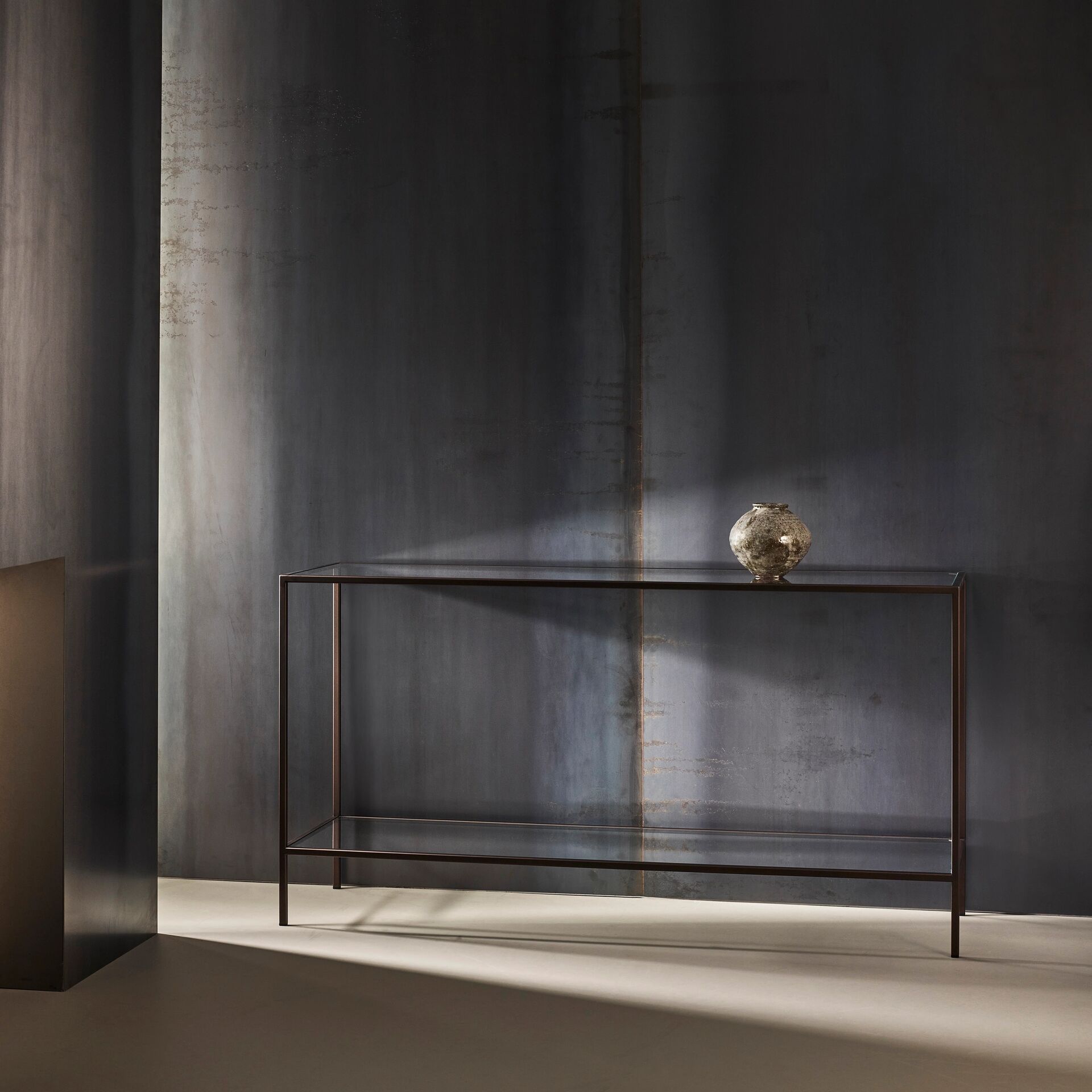 Madison finished in "Bronze" with standard clear glass top and shelf, large
