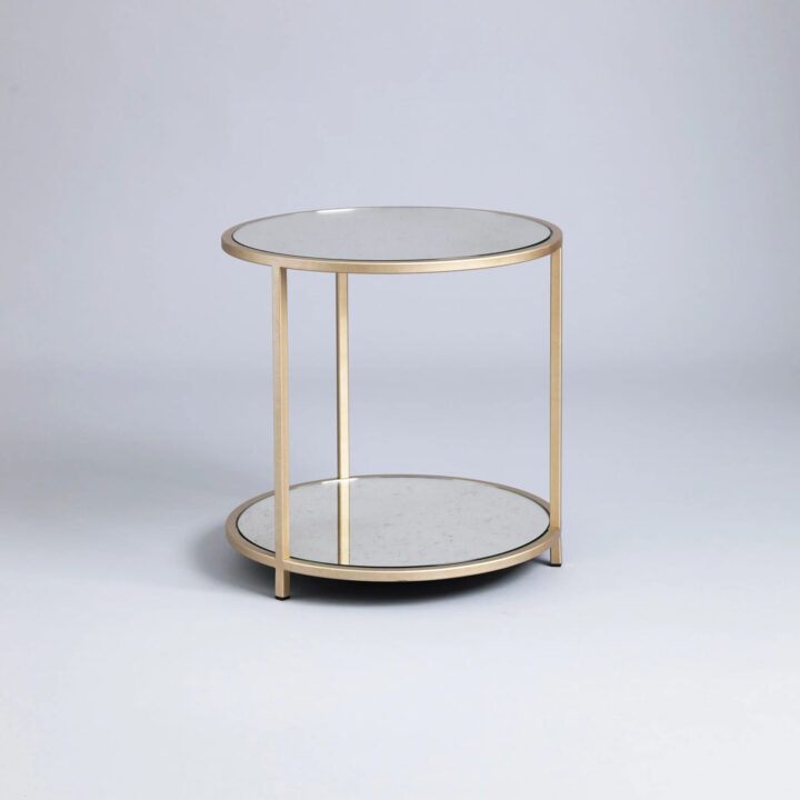 Round metal side table with antiqued glass top