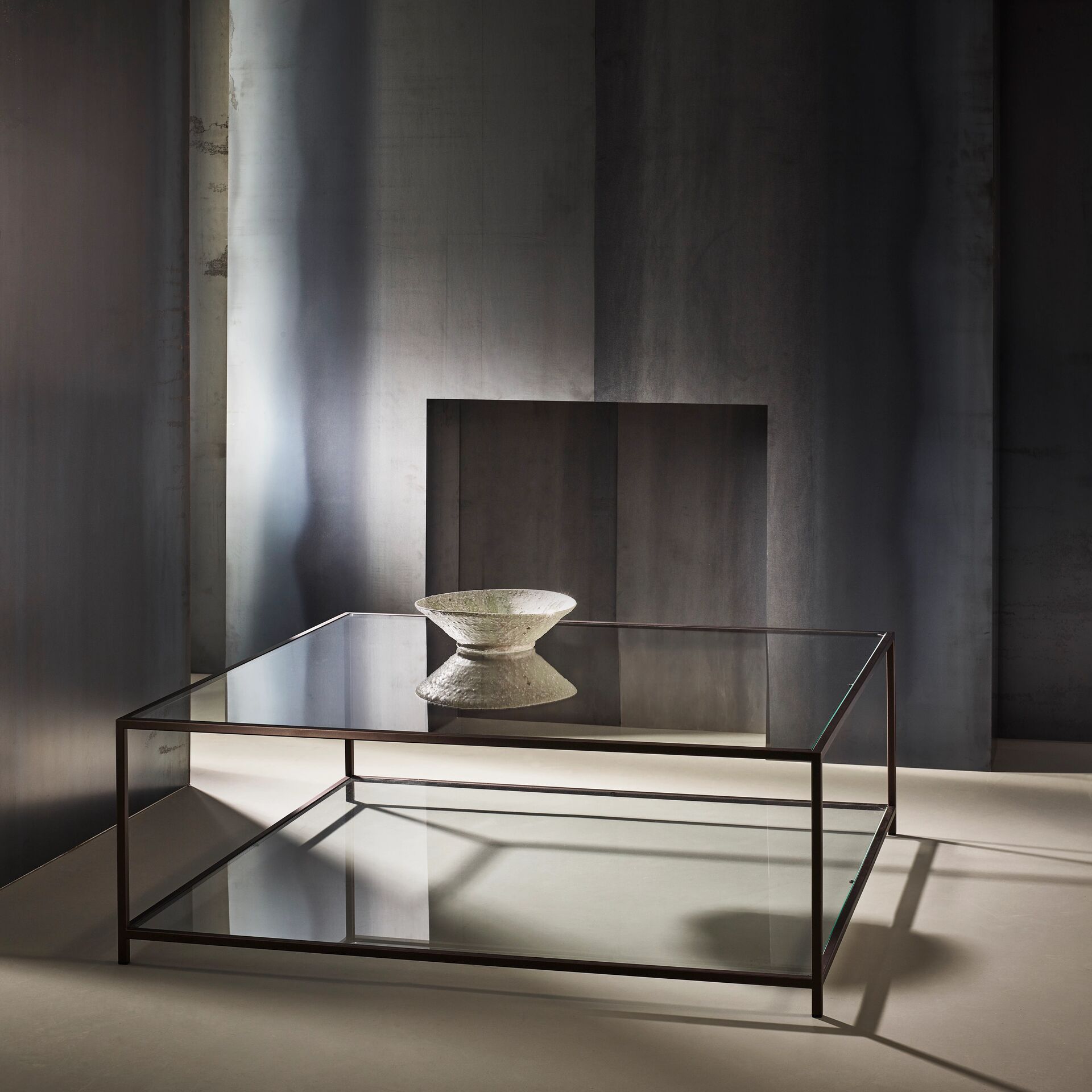 Madison finished in "Bronze" with standard clear glass top and shelf, large