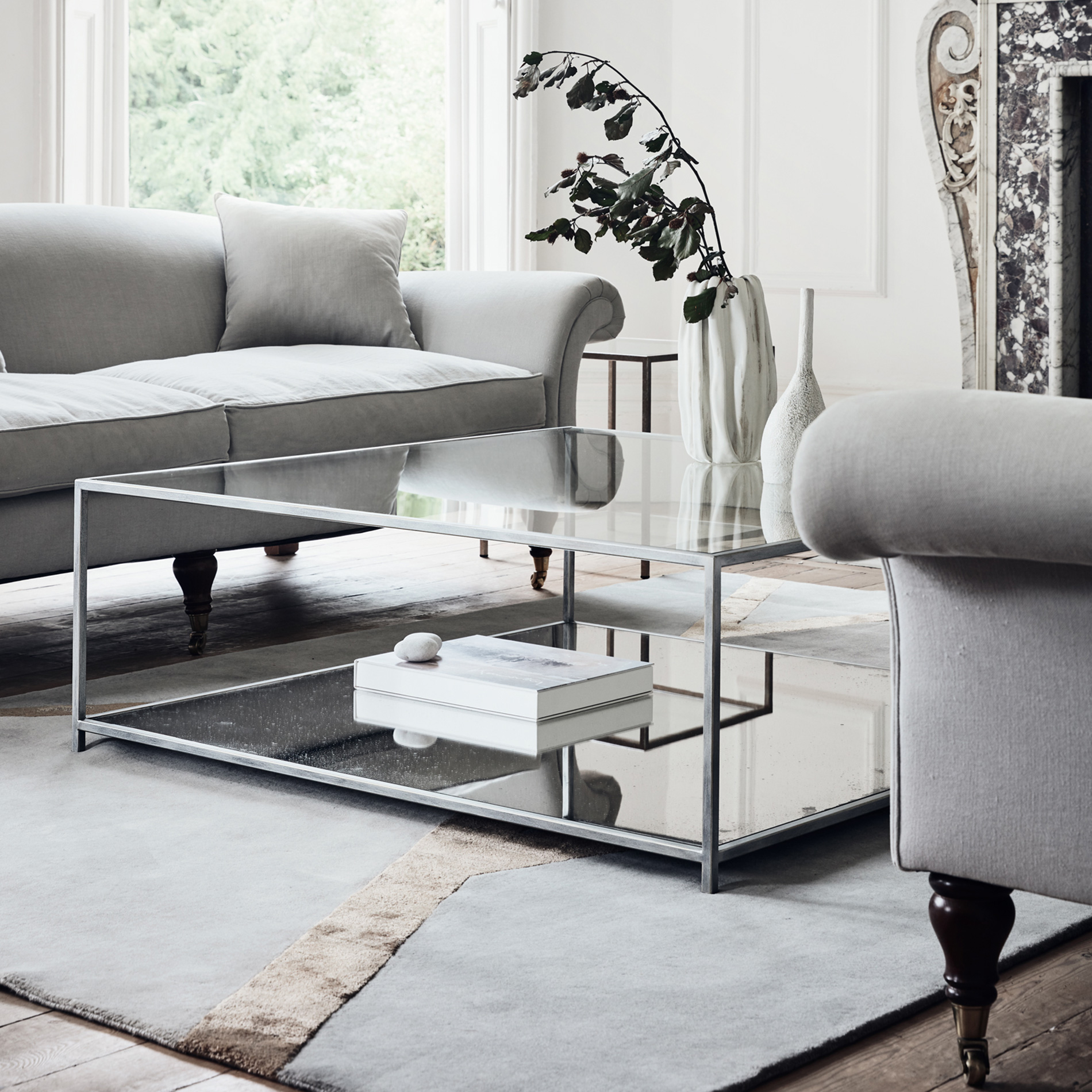 Finished in “Grey Silk” with mirrored shelf