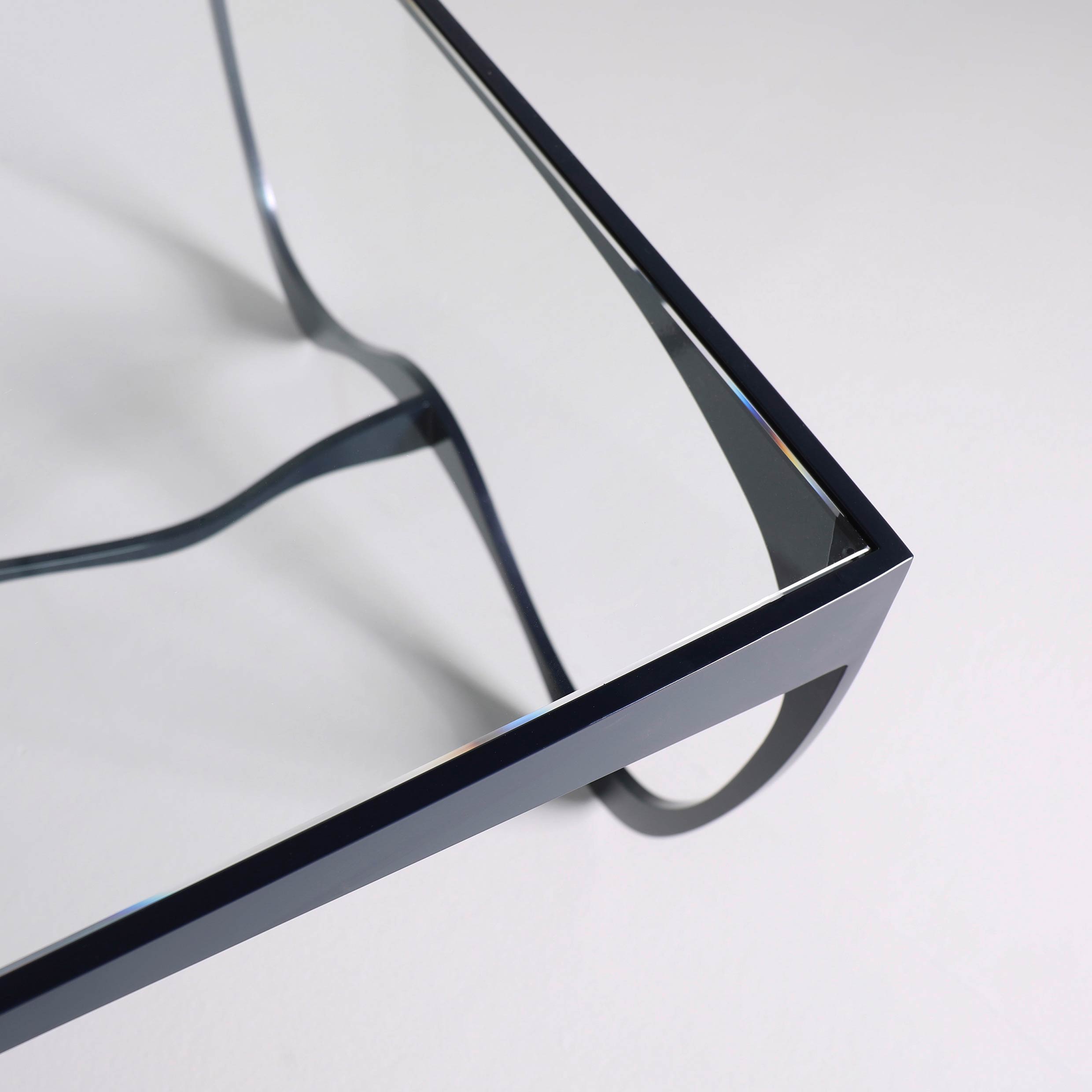 Finished in "Ocean Blue" with a clear glass top