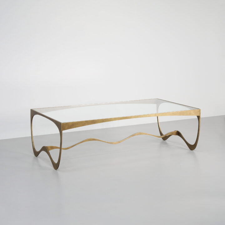 Finished in "Florentine Gold" with a clear glass top