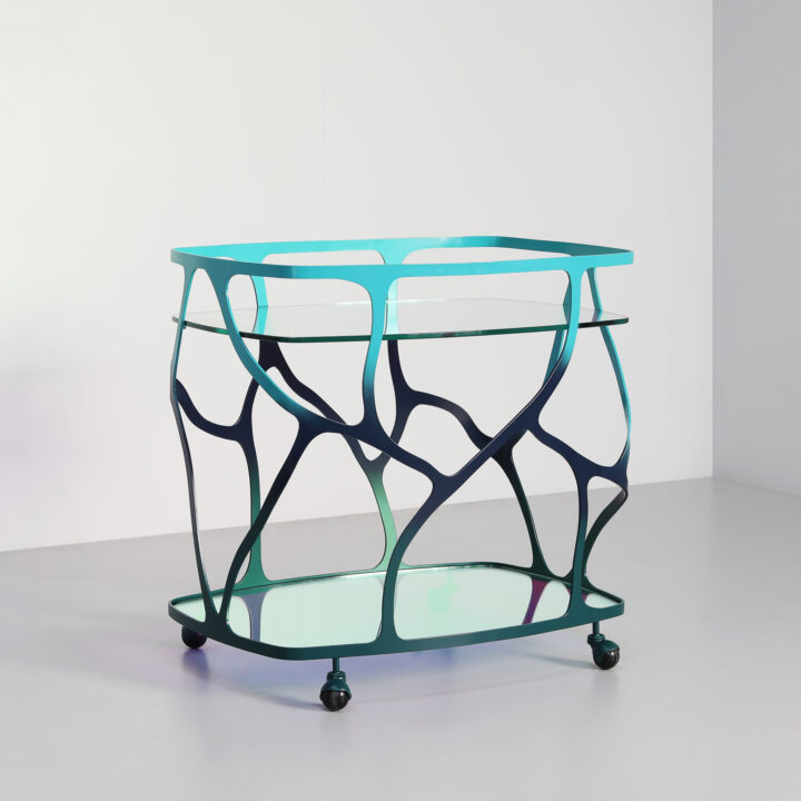 Finished in 'Ulysses Blue' with Dichroic glass top and shelf