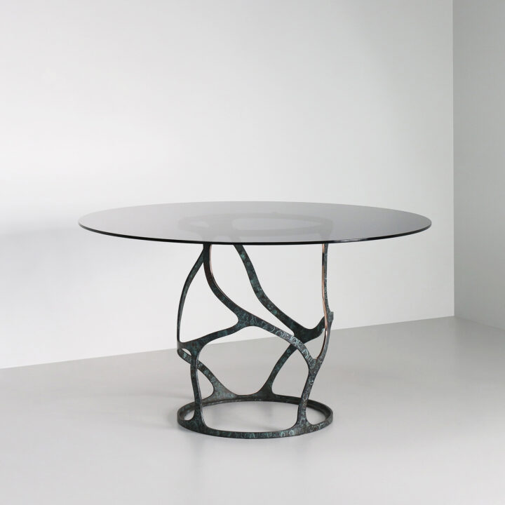 Made in Bronze with "Bottle Green" patina and a smoked glass top