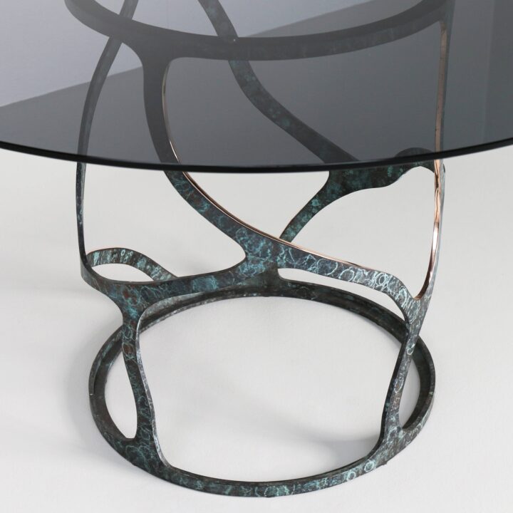 Made in Bronze with "Bottle Green" patina and a smoked glass top