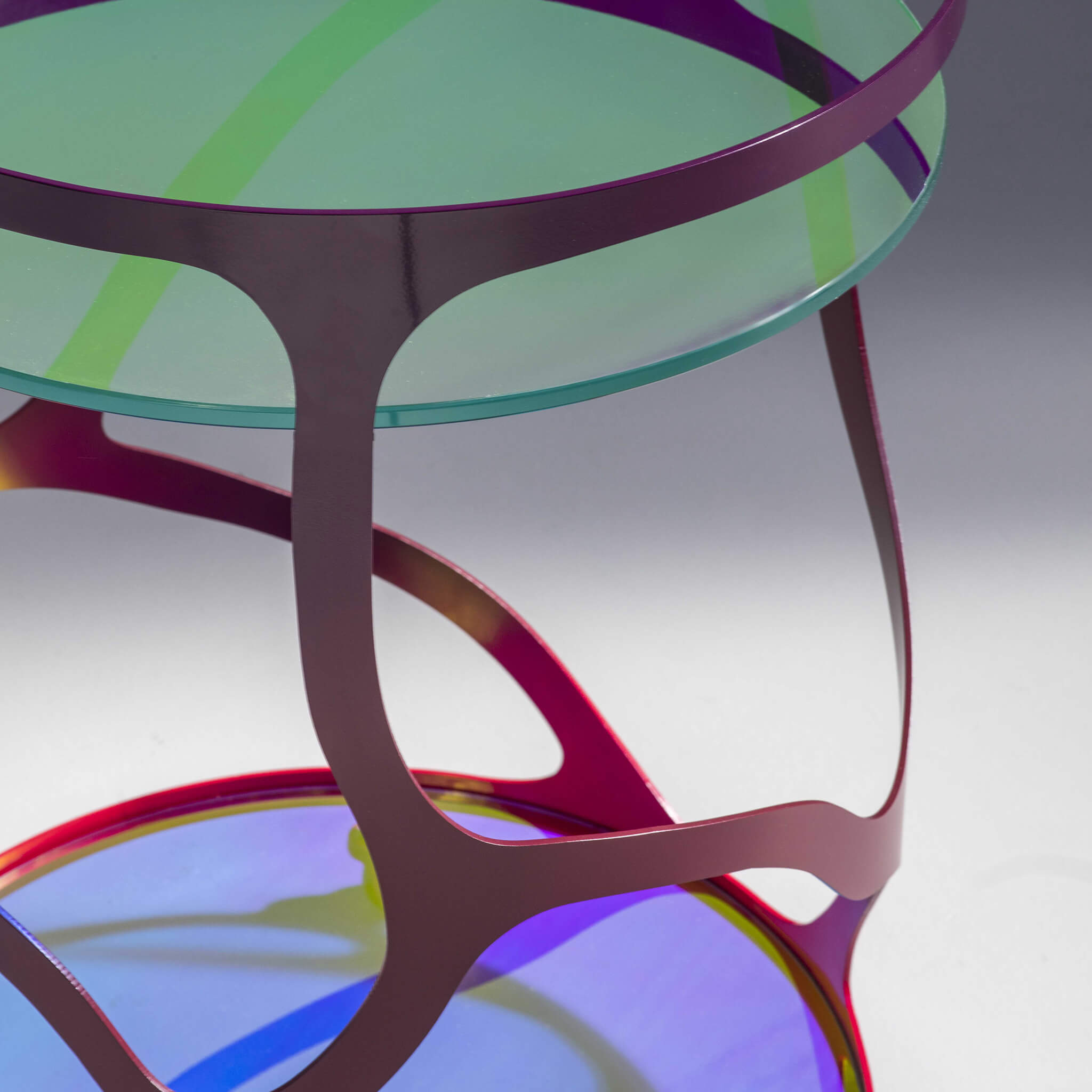 Finished in "Baronet" with Dichroic glass top and shelf