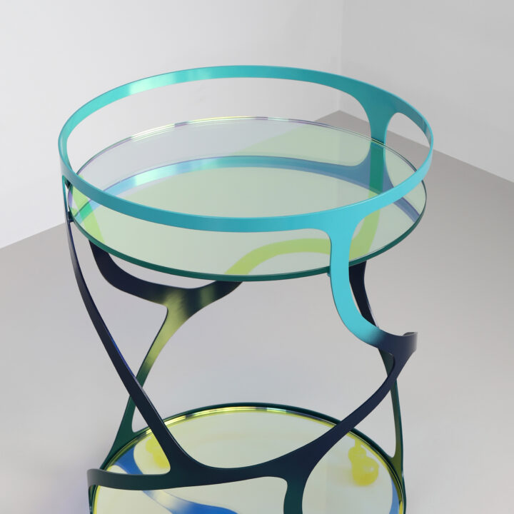 Finished in "Ulysses Blue" with a dichroic glass top and shelf