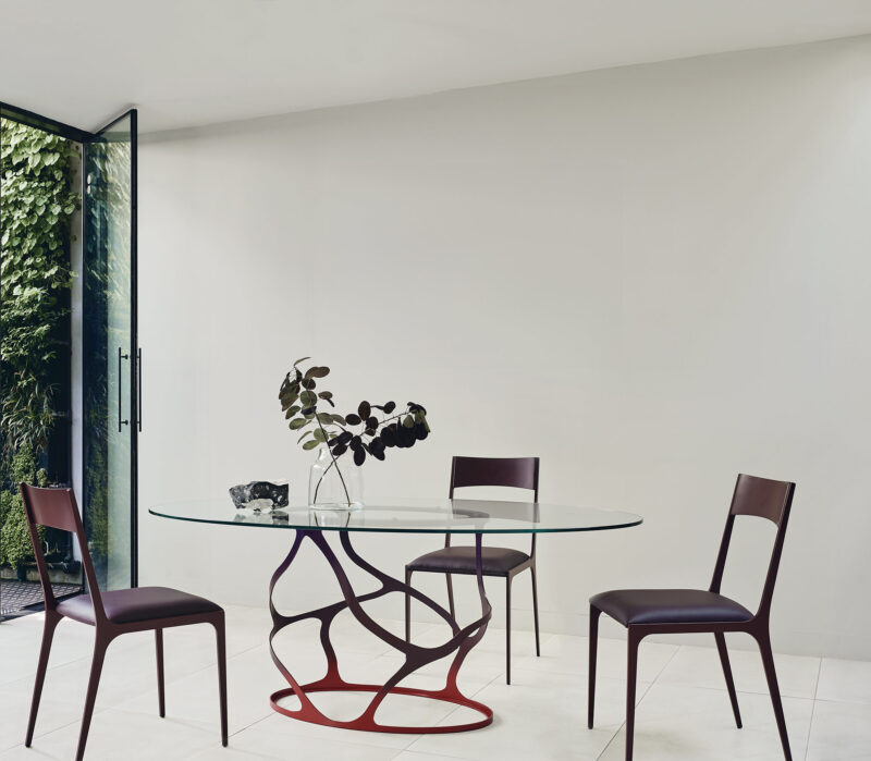 sculptural red glass dining table