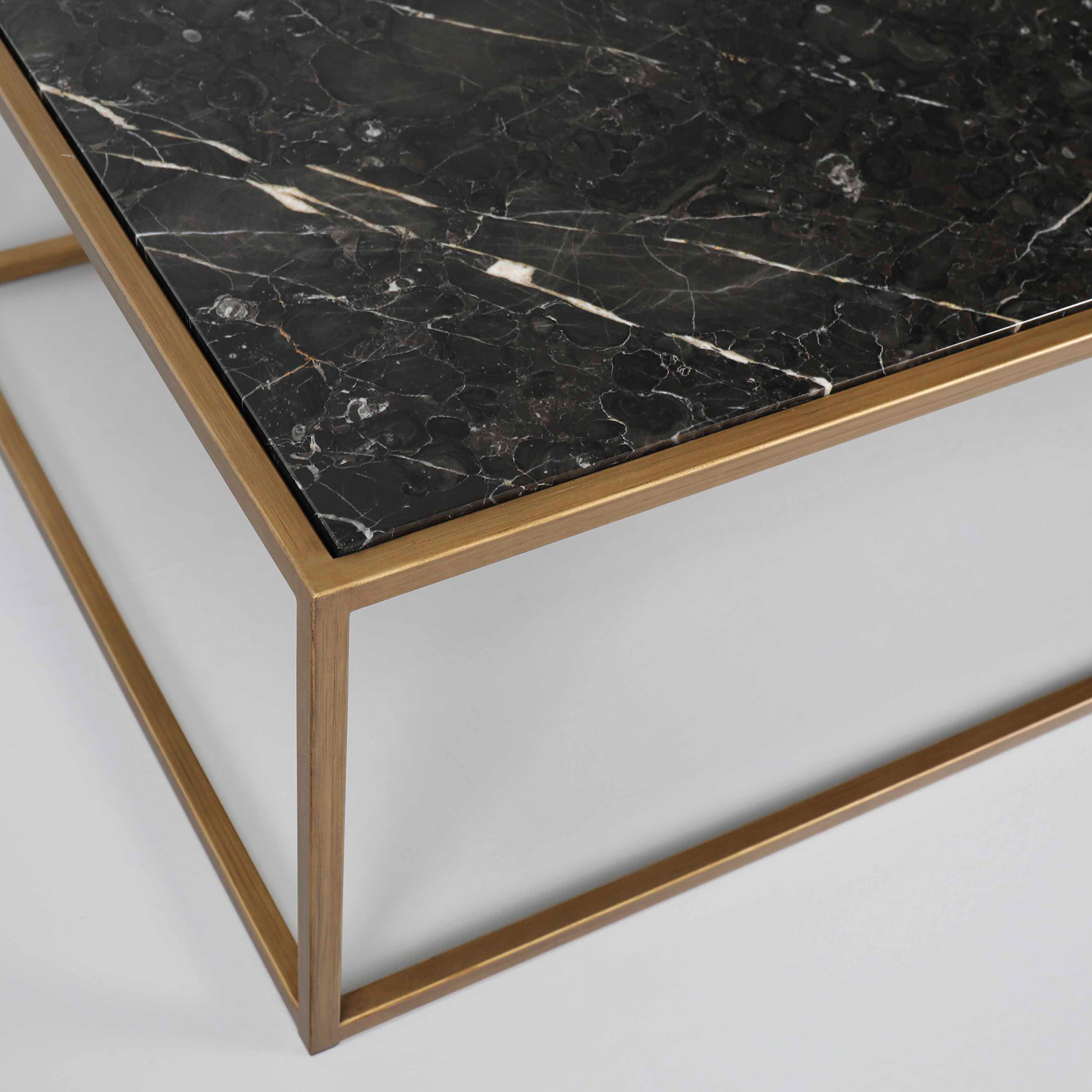 Finished in “Old Brass” with Rosso Noir St. Laurent marble