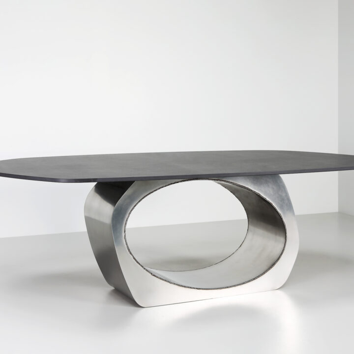 Finished in Satin Polished Stainless Steel with exposed welds and a black stone top