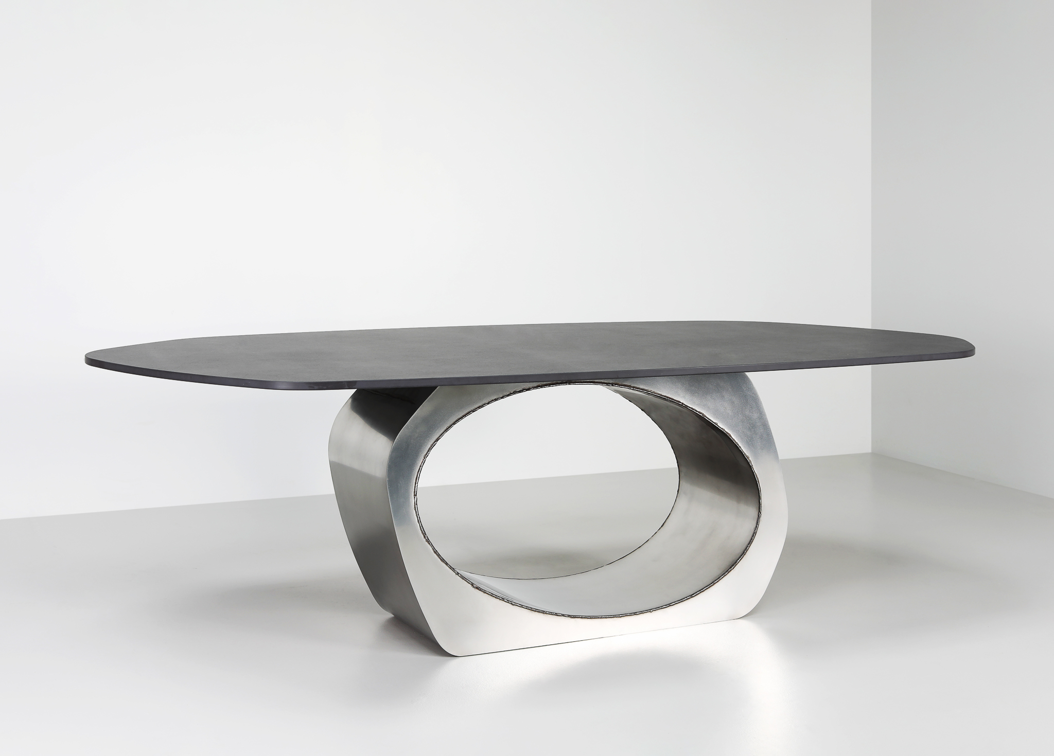 Finished in Satin Polished Stainless Steel with exposed welds and a black stone top