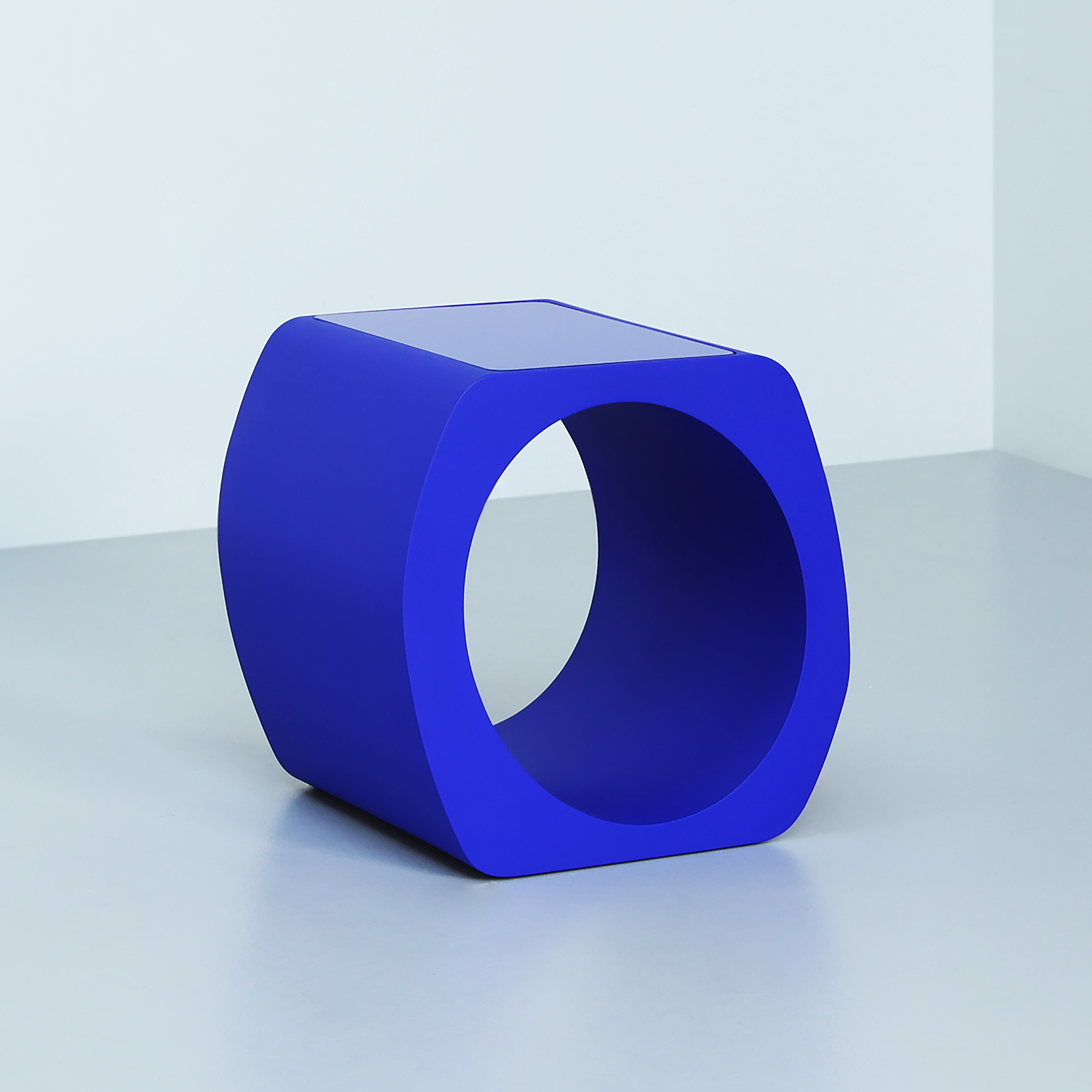 Skye side table finished in "Ultramarine” with glass top