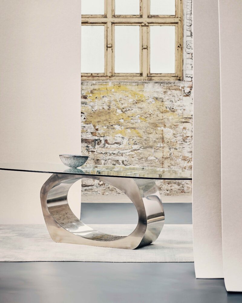 sculptural steel and glass dining table