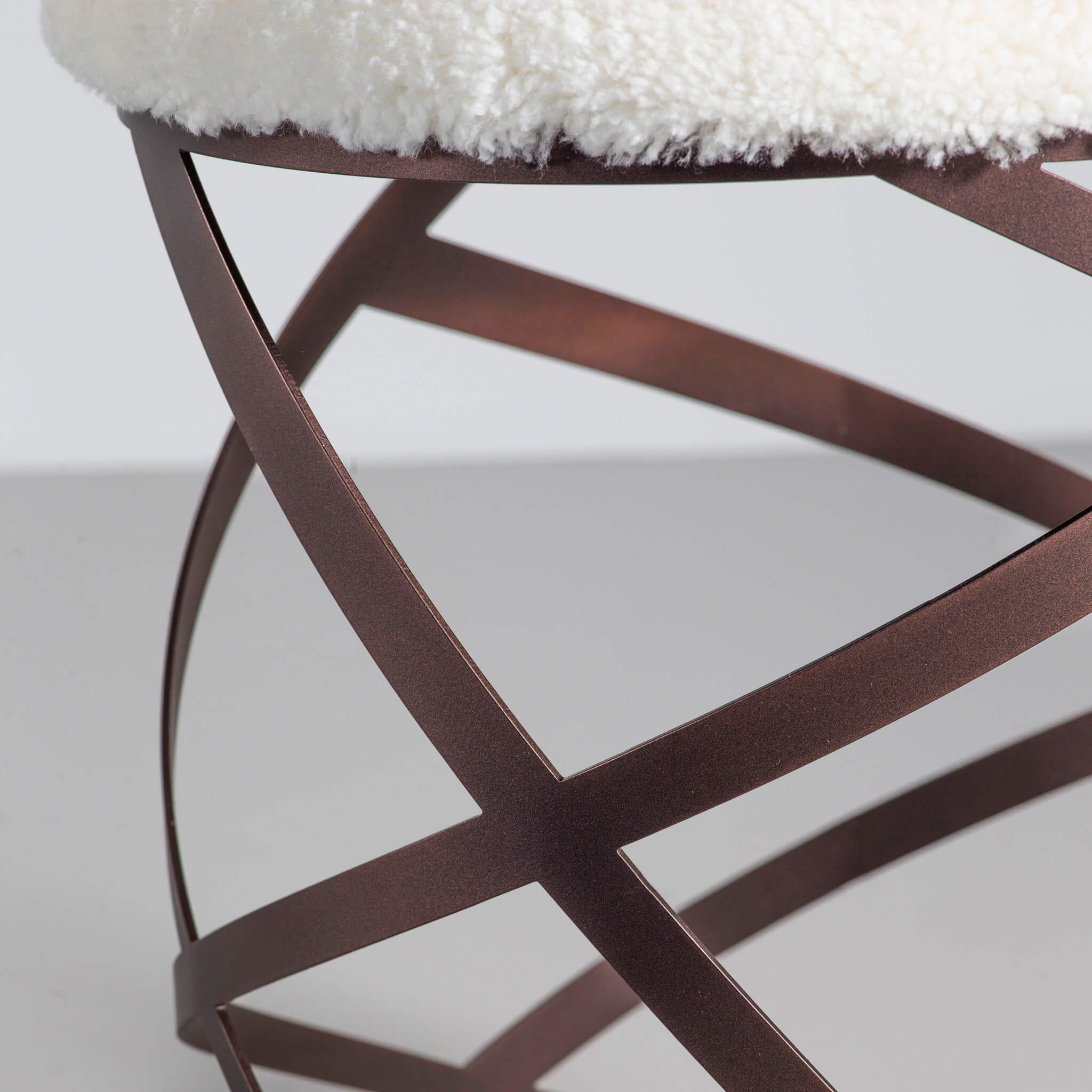 Finished in "Bronze" upholstered in Adam Bray Shearling Lambswool
