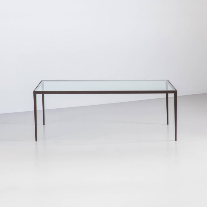 Finished in "Bronze" with a clear glass top