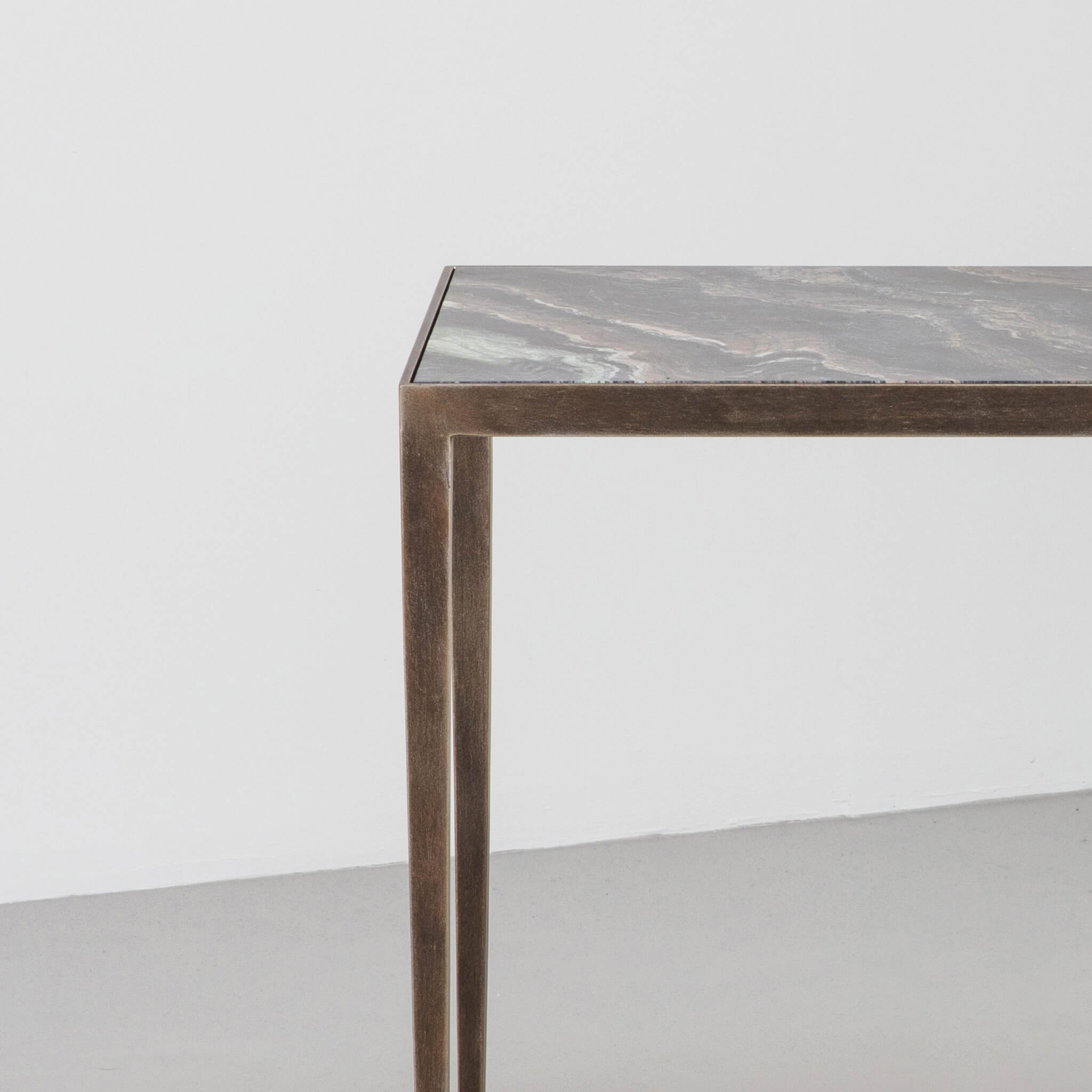 Finished in "Rose Pewter" with a Rosso Luana marble top
